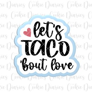 May include: A blue and white cookie cutter in the shape of a cloud with the text "Let's Taco 'bout Love" in black lettering and a small red heart.