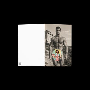 May include: A folded greeting card featuring a black and white photograph of a muscular person standing outdoors near a building. A circular sticker with a colorful illustration of a person wearing a pink apron is placed over the center area.