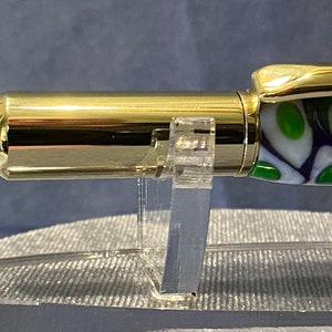 Rollester Rollerball Pen. Gold with Genesis Mardi Gras acrylic black in beautiful purple, green and white. Cap posts on back.