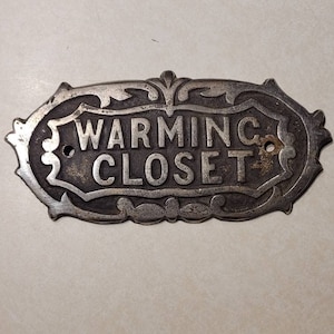 Malleable Iron Range Company Warming Closet Badge/Emblem