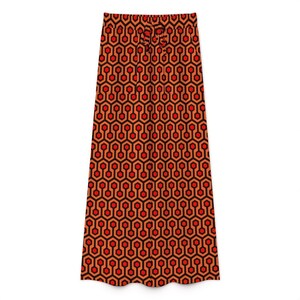 a long skirt with a repeating pattern of orange and black hexagons.