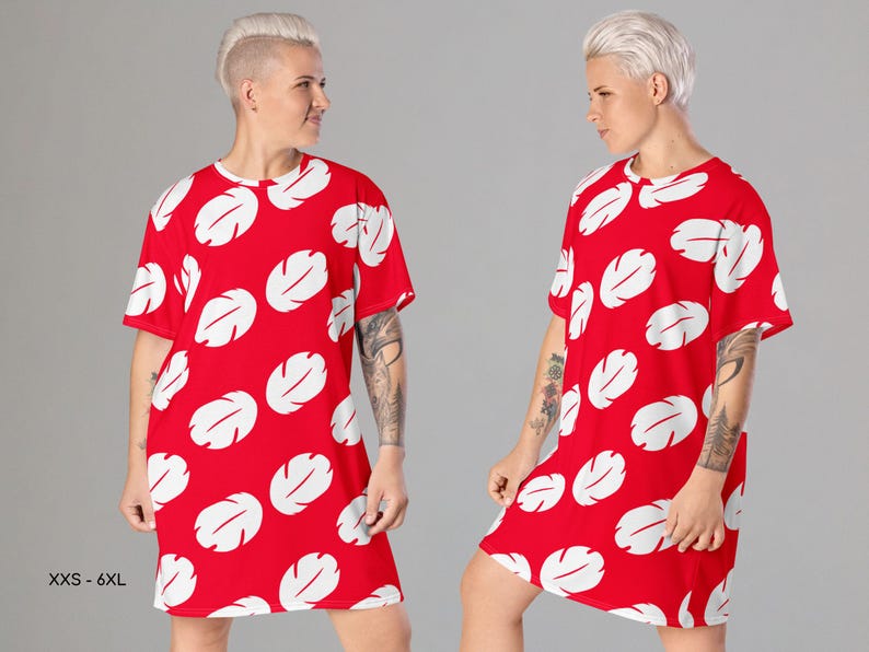 a man with white hair wearing a red dress