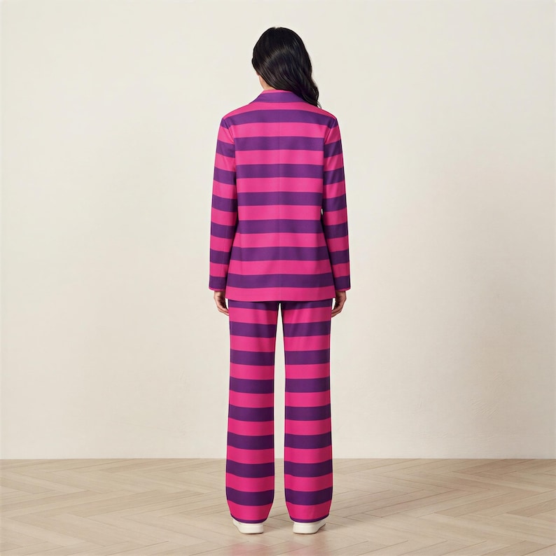 A person wearing a pink and purple striped suit stands facing away from the camera.