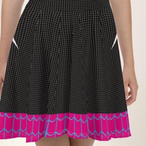 a woman wearing a black and pink skirt