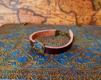 Steampunk strap brown leather band with watch parts and gears caught in the resin by the cogs of time