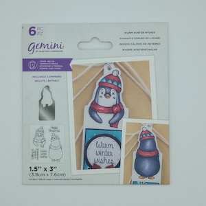 May include: A set of six penguin-themed stamps and dies for crafting. The stamps feature penguins wearing scarves and hats with the text "Warm winter wishes". The dies are for cutting out the penguin shapes. The set is 1.5 inches by 3 inches.