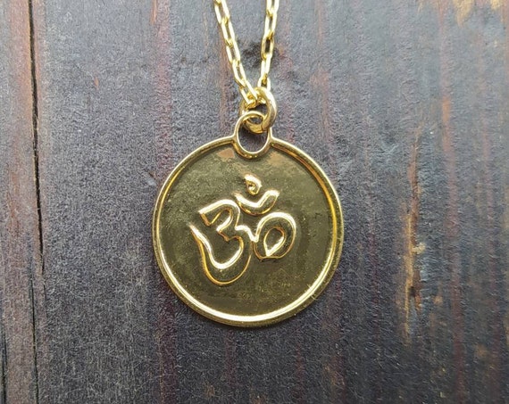 Gold Om Symbol Necklace. one piece jewelry.