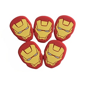 May include: Five red and yellow Iron Man character shoe charms.
