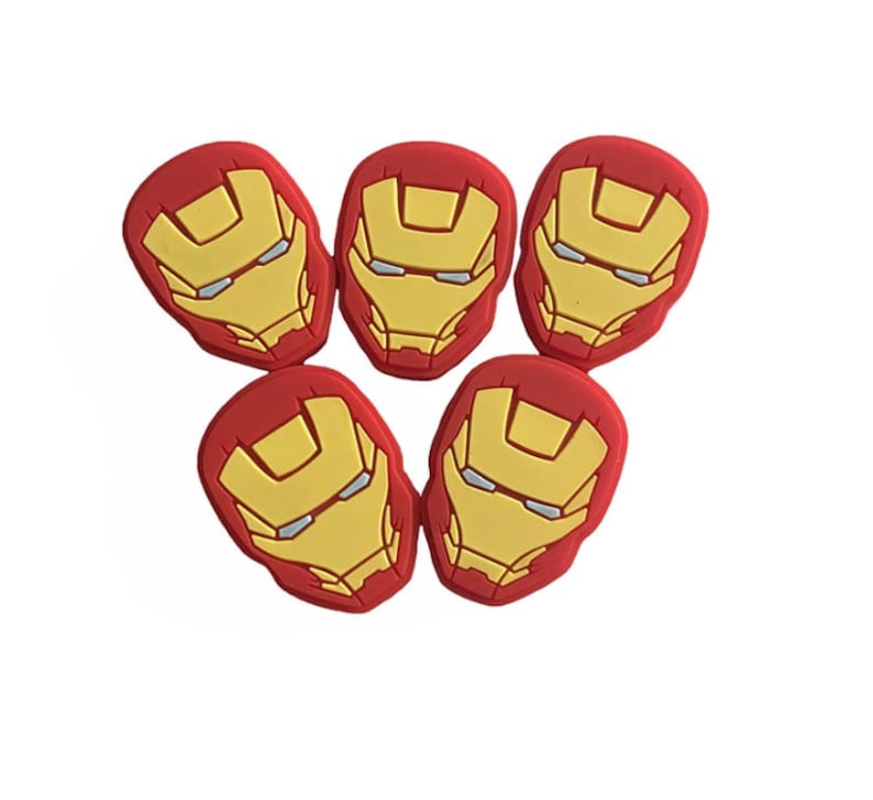 May include: Five red and yellow Iron Man character shoe charms.