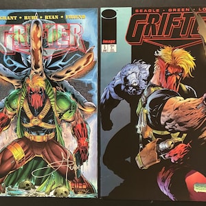 May include: Two Grifter comic books from Image Comics, issue number 5. The left cover features a character in a green and red suit with a mask, while the right cover shows the same character holding a glowing blade with a blue creature behind.