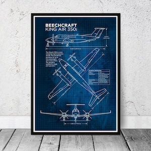 May include: A framed blueprint of a Beechcraft King Air 350i aircraft, with white line drawings on a dark blue grid. The poster includes technical specifications and measurements, showing the aircraft from various perspectives.