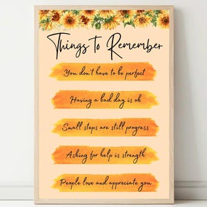 May include: A motivational poster with a peach background and a sunflower border. The poster features five orange watercolour stripes with inspirational messages in black text: "You don't have to be perfect", "Having a bad day is ok", "Small steps are still progress", "Asking for help is strength", and "People love and appreciate you".