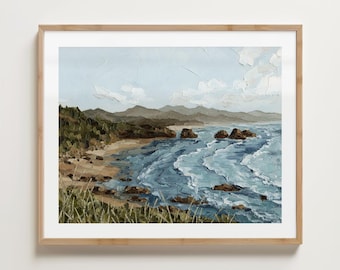 May include: A framed landscape painting of a coastal scene. The artwork depicts a beach with rolling waves, rocky formations, and a mountain range under a cloudy sky. The color palette includes blues, greens, and browns.