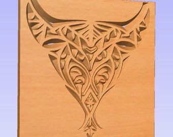 May include: A light brown wooden panel featuring a carved design of a stylized bull's head. The design includes intricate patterns of curved lines and shapes, creating a textured, three-dimensional effect. The panel is square and has a smooth finish.
