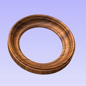 Peut inclure: Un cadre photo rond en bois avec une finition en bois naturel. Le cadre a un design simple et classique.