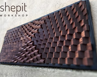 May include: A dark brown wooden wall art piece with a geometric pattern of squares and rectangles. The piece is framed in black and has the text "shepit WORKSHOP" in white letters at the top.