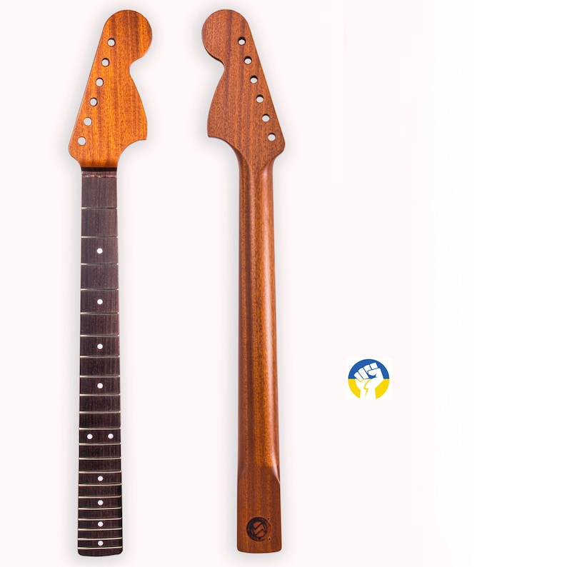 May include: Two unfinished guitar necks made of mahogany wood. The necks are both in the same style, with a rounded headstock and a single-coil pickup.