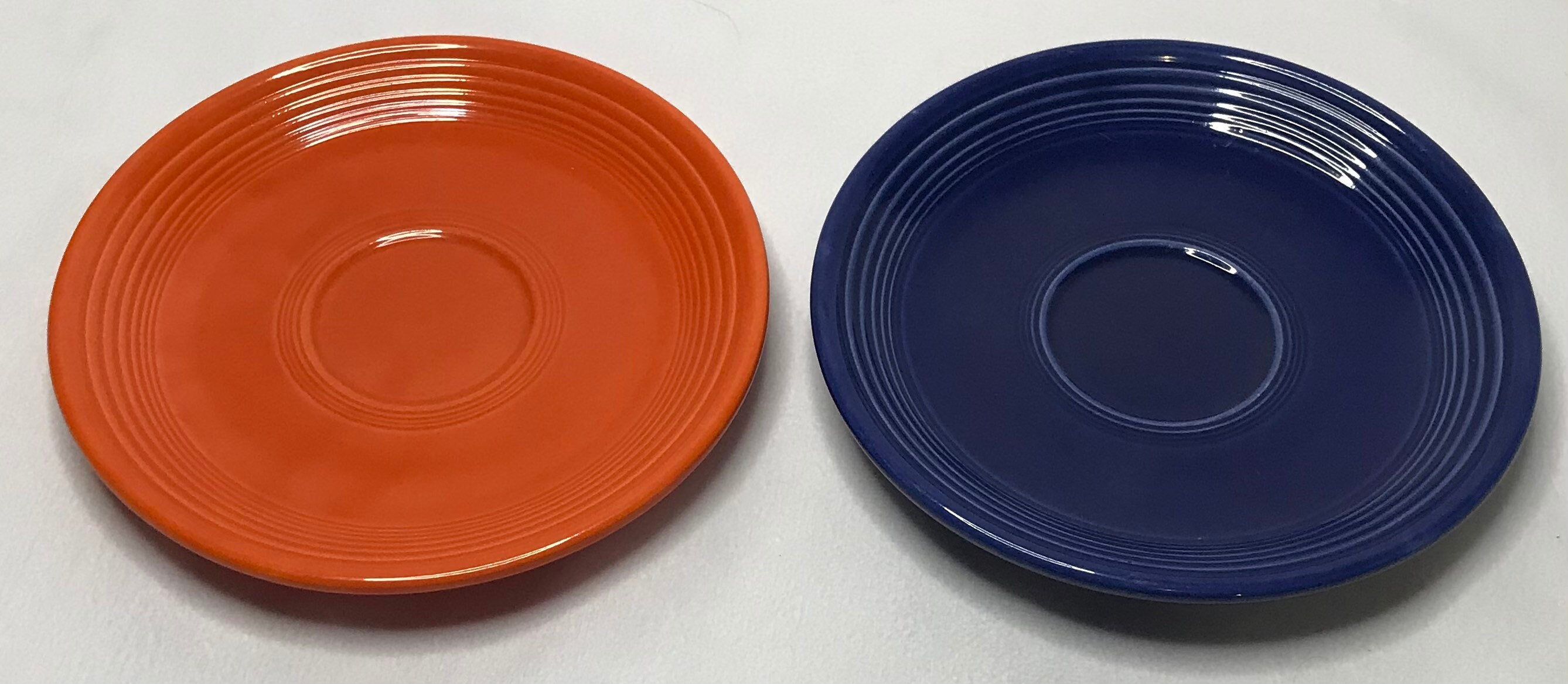 Vintage unmarked Fiestaware set of two saucers in orange and Etsy