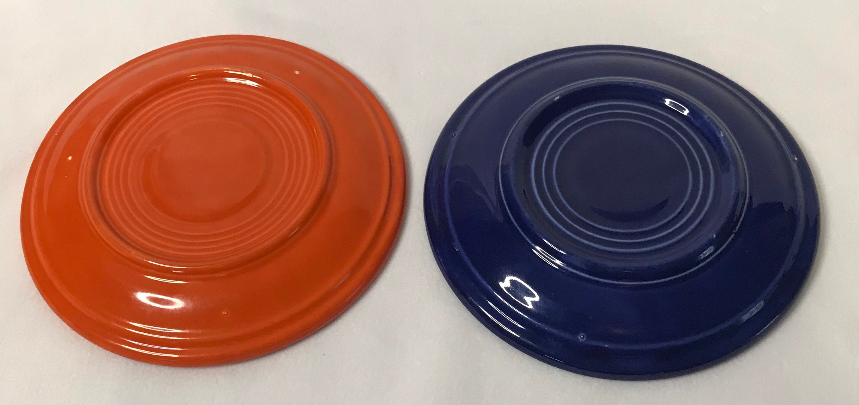 Vintage unmarked Fiestaware set of two saucers in orange and Etsy