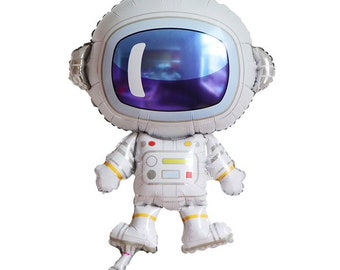 Può includere: Un palloncino astronauta bianco con una visiera viola e dettagli gialli. Il palloncino è gonfiato e pronto per essere utilizzato per una festa o una celebrazione.