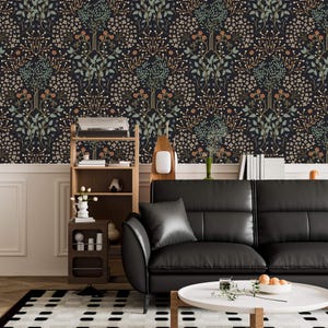 May include: A black leather sofa with a white coffee table in front of it. The wall behind the sofa is covered in dark wallpaper with a floral pattern. There is a wooden shelf unit to the left of the sofa.