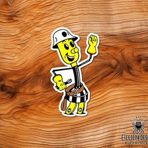 May include: A sticker featuring a cartoon construction worker with a yellow body, white hard hat, and black and white striped pants. The worker is wearing a tool belt and yellow gloves, with a friendly expression and raised hand.