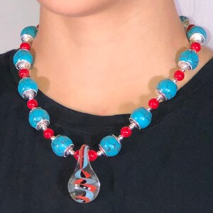 Beaded necklace. Turquoise beads. Silver beads. Handblown glass pendant.