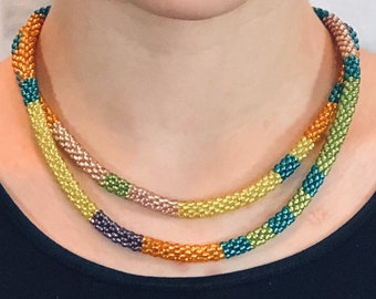 Beaded necklace. Sparkly multicolored (green, orange, teal, yellow) beads. Bead crochet. Delicate and fluid.