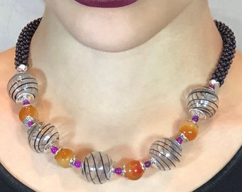 Beaded necklace. Hand-blown glass beads. Golden jade beads. Purple Czech glass beads. Hot pink beads. Silver beads.