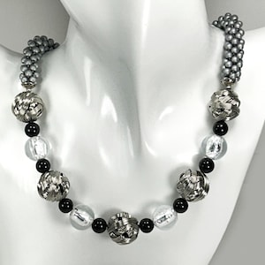 Beaded Necklace. Avant-garde necklace. Stainless woven beads. Black beads. Silver foil beads. Bead crochet.