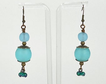 Earrings. Beautiful Frosted Glass Turquoise Beads with Tiny Cluster Drops.  Brass Accents. Dangle earrings. Enjoy!