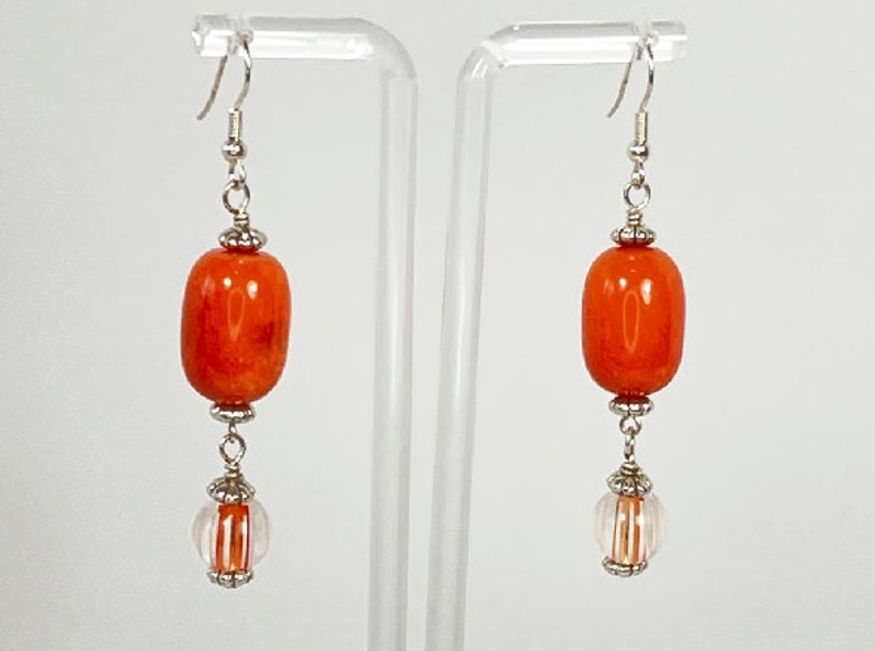 Earrings. Beautiful Orange Glass Earrings with Hand Blown dangling Beads. Silver Accents. You will enjoy wearing these earrings. image 1