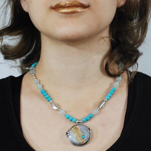 Beaded necklace. Charming necklace made of Turquoise Beads, Agate Beads, Pewter Beads with Silver Accents and a Poly and Silver Pendant