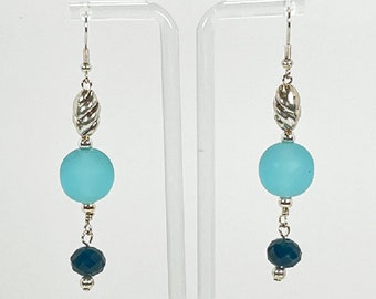 Earrings. Beautiful Frosted Glass Turquoise Beads with Tiny Teal Glass Bead Dangle. Silver and Pewter Accents. Dangle earrings. Enjoy!