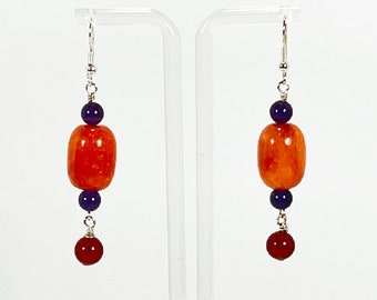 Earrings. Beautiful Orange Ceramic Bead Earrings. Amethyst and Garnet Accent Beads. Dangle earrings. You will enjoy wearing these earrings.