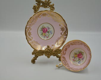 Paragon Double Warrant Pink Teacup with Heavy Gold Detailing and Rose Floral Bouquet in Center