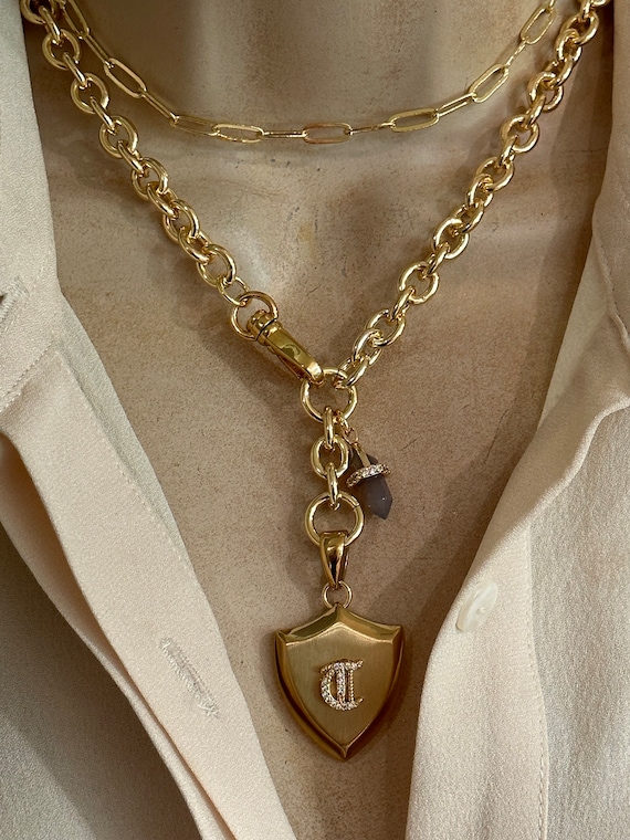 Personalized shield and spike gemstone necklace