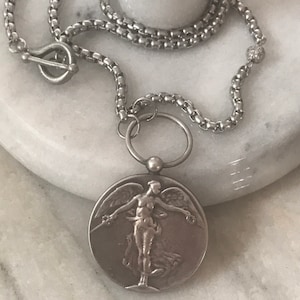 Antique silver angel medallion/Fleur de Lis necklace