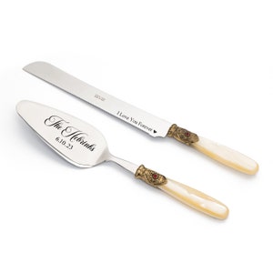 Cake Server and Knife Cutting Set for Wedding with Ivory Pearl Handle Antique Gold Washed Metal Ring with a Red Stone Decoration