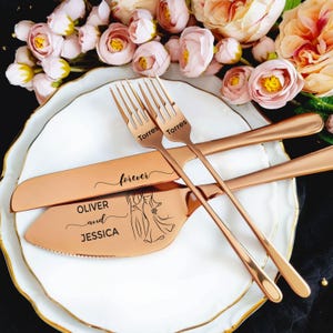 Personalized 4-piece rose gold wedding cake cutting set with a warm copper-toned finish. Mirror-polished server engraved with Oliver and Jessica and bride and groom line art. Knife features 'forever' script. Shown on white plates with romantic roses.