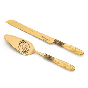 Luxury Cake Server and Knife Set for Wedding with Gold Fabric Effect Handle Antique Gold Washed Metal Ring with a Red Stone Decoration