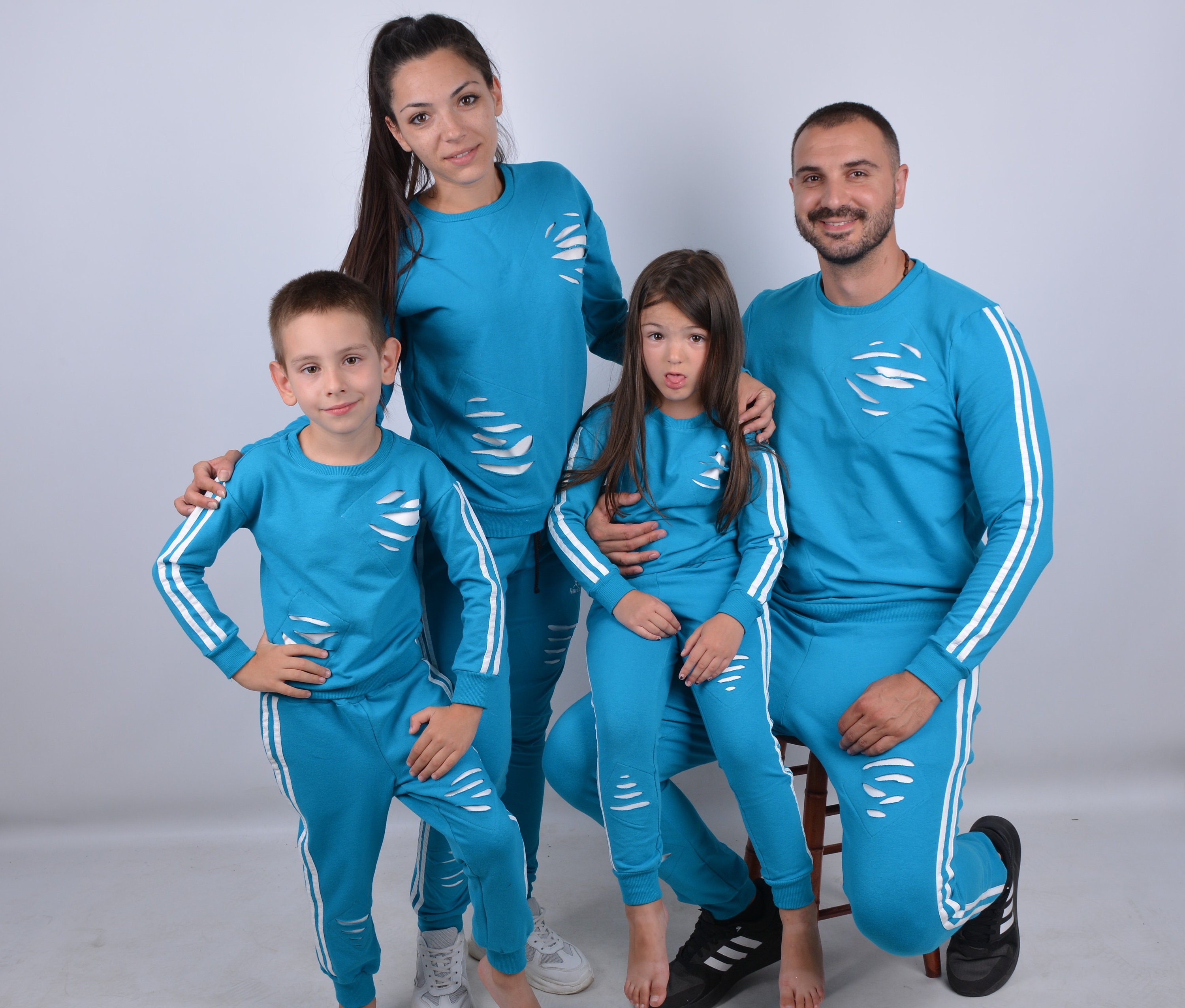 men and women matching sweatsuits