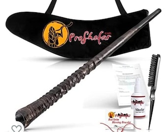 May include: A black velvet bag with a brown wooden shofar, a cleaning brush, a bottle of shofar oil, and a red string bracelet. The bag has the text "Proshofar.com" embroidered on it.
