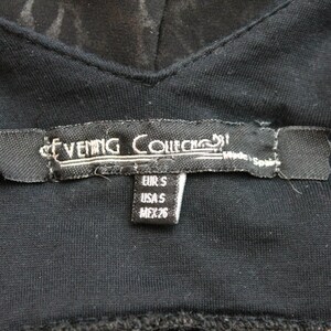 May include: Black clothing label with white text that reads "Evening Collection" and size information: EUR S, USA S, MEX 26.