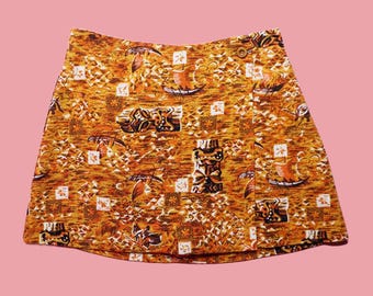 1990s ISAAC MIZRAHI. ISAAC. Orange and Brown. Printed. Island Tiki. Faux Wrap Mini Skirt with Shorts. Small