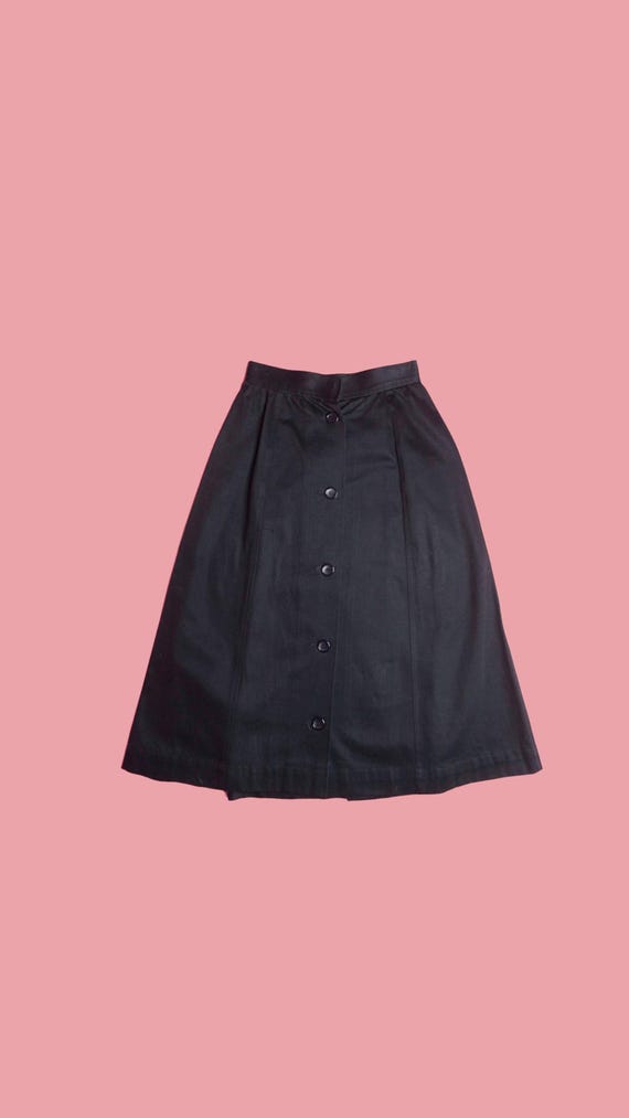 Yves Saint Laurent Rive Gauche, 1970s-1980s. SAINT LAURENT. Rive Gauche. I. MAGNIN. Black Button Up. High Waist. A-Line Skirt with Back Slit. Extra Small