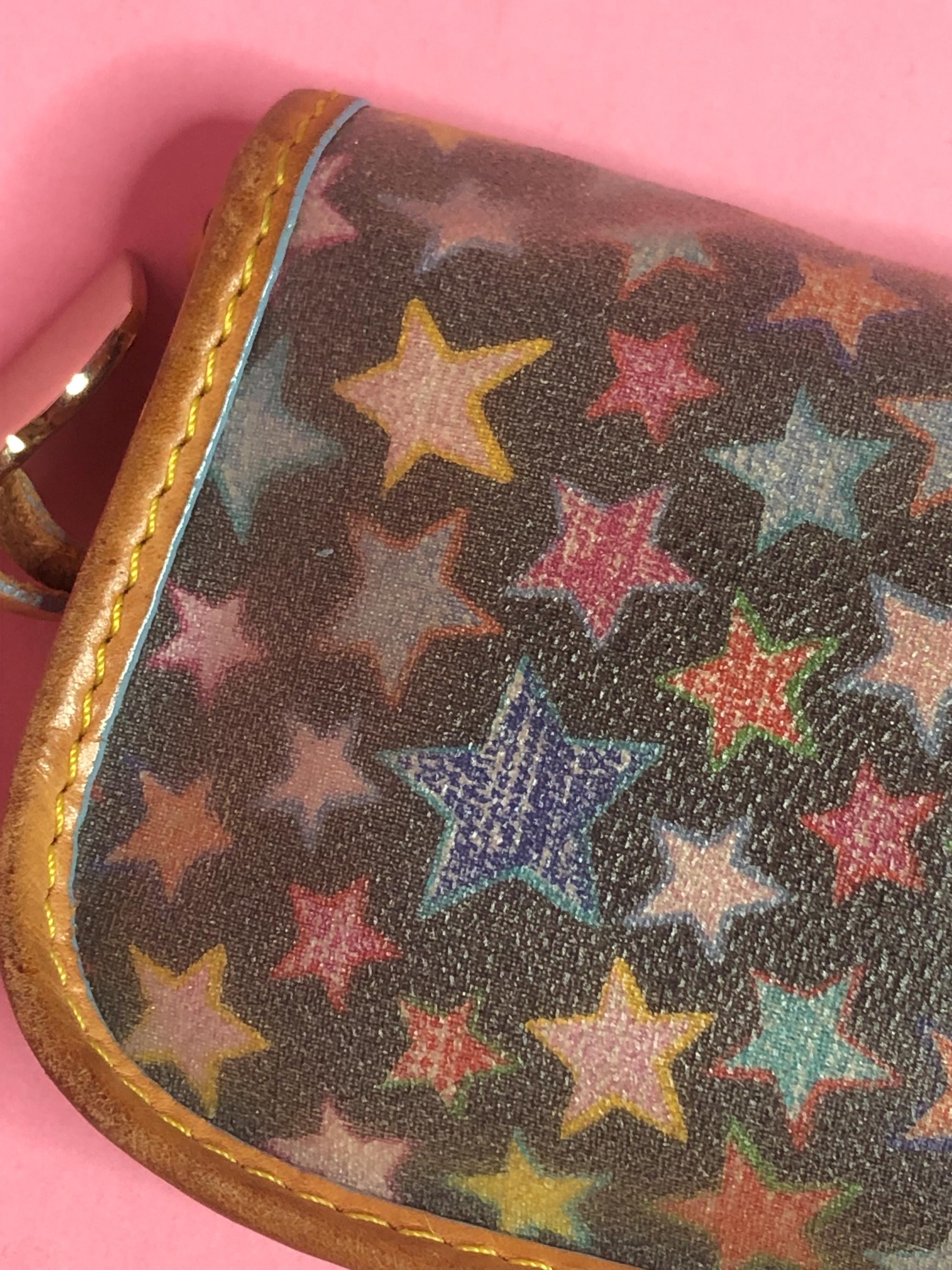 Y2K 2000s DOONEY and BOURKE Rainbow STAR. Celestial. Black. Coated 