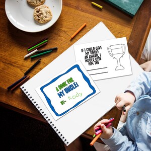 May include: A white printable book cover with blue and green borders. The text on the cover reads "A Book for My Uncle!" with the name "Kody" written below. A separate white printable card with a trophy outline and the text "If I could give my uncle an award, I would give him the" is also visible.