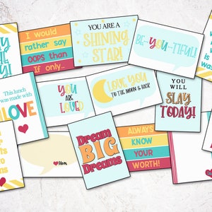 May include: A set of 12 colorful affirmation cards with positive messages like "You are loved", "Dream Big Dreams", and "Slay the Day". The cards are printed on white cardstock with a variety of bright colors and patterns.