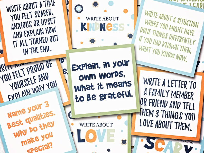 May include: A set of colorful cards with writing prompts for journaling or creative writing exercises. The prompts include topics like kindness, love, gratitude, and scary experiences.